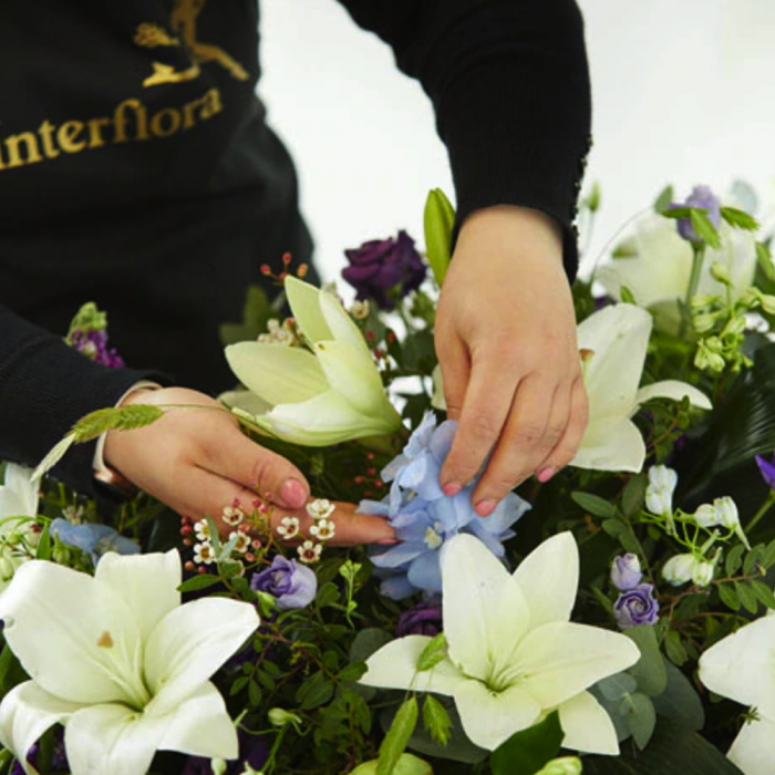 ‘The Flower Shop Helensburgh - Blue And White Casket Spray’